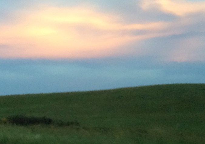 This through-the-windshield iPhone shot somewhere between Junction City and Lawrence, on the eastern edge of the Flint Hills, is so out of focus that it has an impressionistic quality.